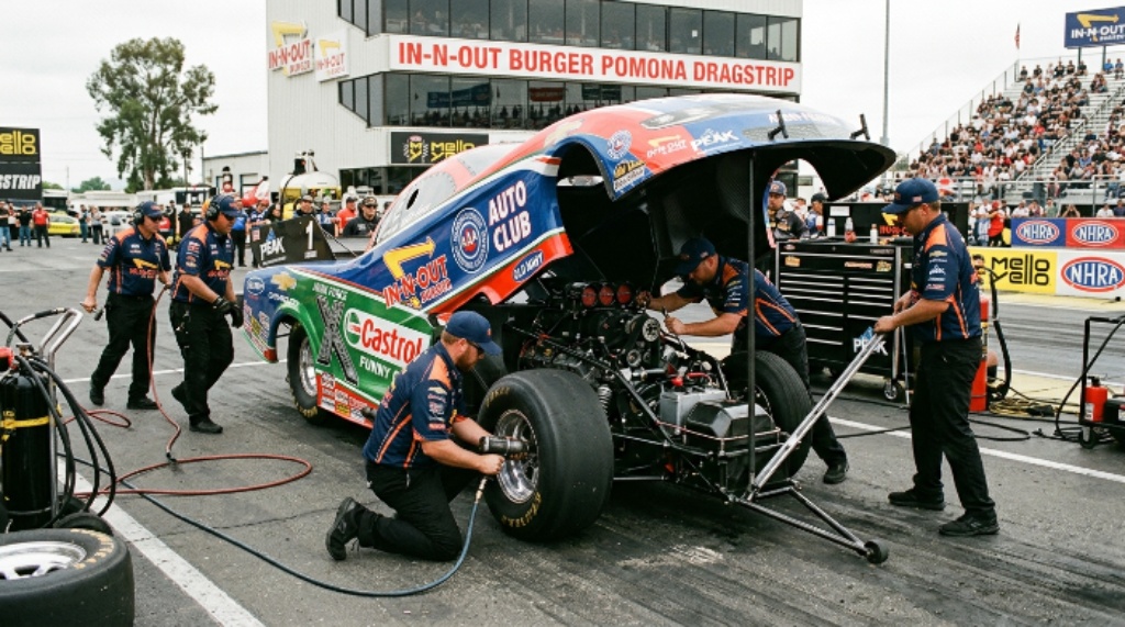 NHRA pit crew working on Funny Car at In-N-Out Burger Pomona Dragstrip