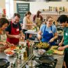 People cooking together during a beginner-friendly cooking club session
