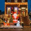Decorated Brooklyn house with holiday lights and inflatable Santa display