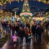 Families walking through thousands of glittering holiday lights and decorated trees at Christmas in the Park 2026 at Plaza de Cesar Chavez in downtown San Jose, California