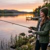 Beginner fishing rod and tape measure laid out on wooden dock