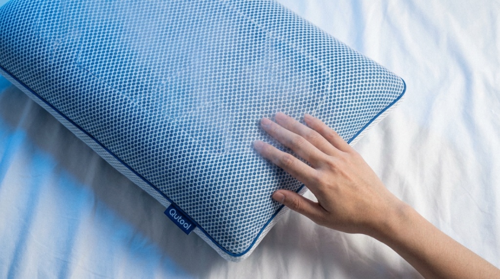 A relaxed person sleeping comfortably on a cooling pillow at night.