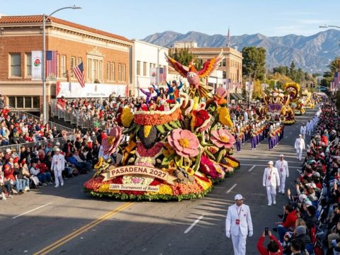 Colorful floral floats moving along Colorado Boulevard during the Rose Parade in Pasadena on New Year's Day 2027